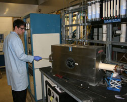 Clayton Burkhardt operating the tube furnace